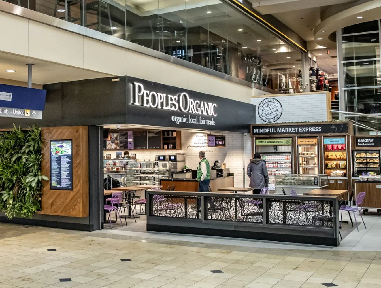 Organic café storefront inside airport terminal.